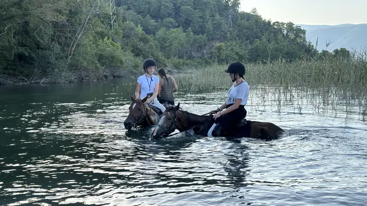Two riders in the lake